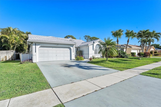 view of front facade featuring a front lawn and a garage