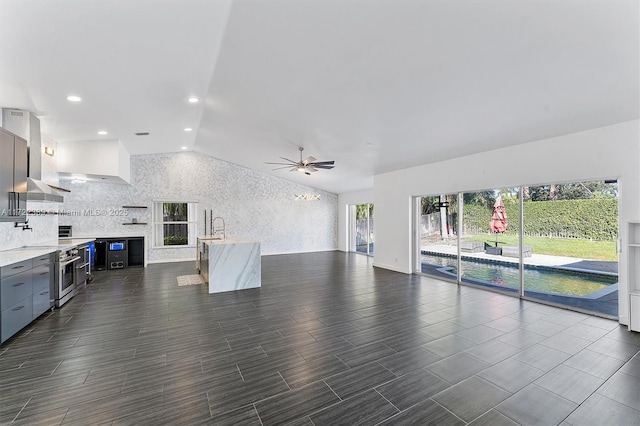 living room with vaulted ceiling and ceiling fan