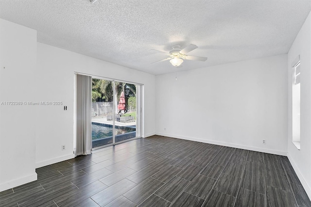 unfurnished room featuring ceiling fan and a textured ceiling