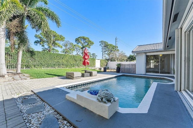 view of swimming pool with a patio