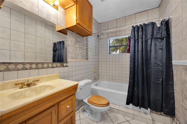 full bathroom featuring vanity, tile patterned floors, toilet, tile walls, and shower / tub combo with curtain