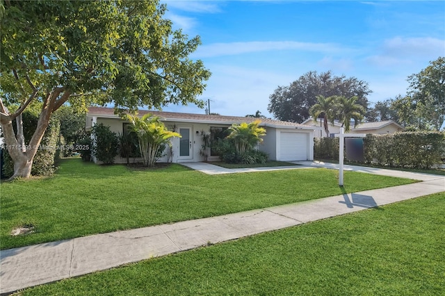 single story home with a front lawn and a garage