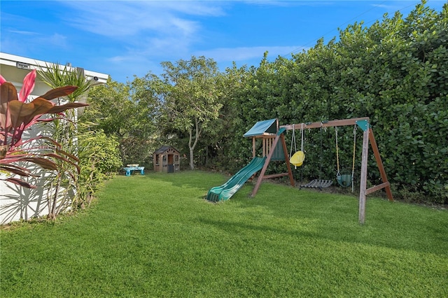 view of jungle gym featuring a lawn