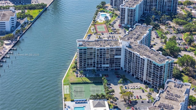 birds eye view of property with a water view