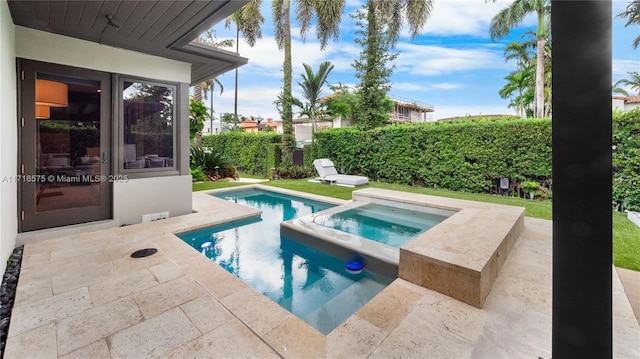 view of pool featuring an in ground hot tub