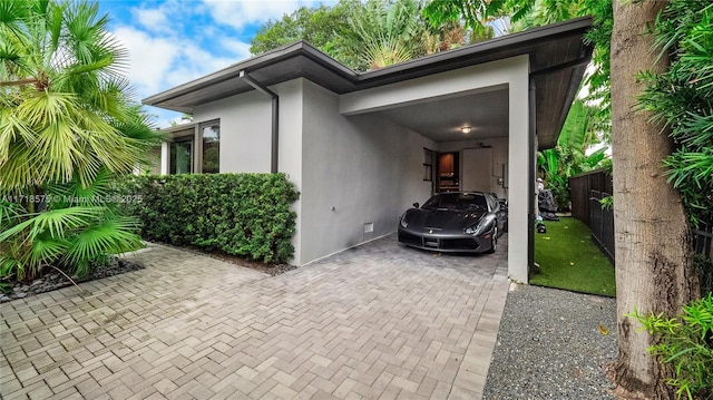 view of side of property featuring a carport