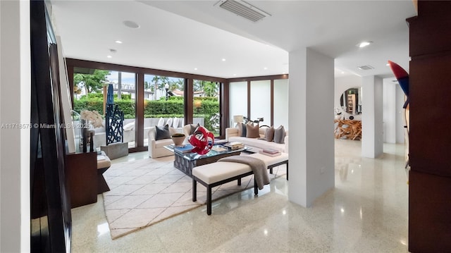 living room featuring expansive windows