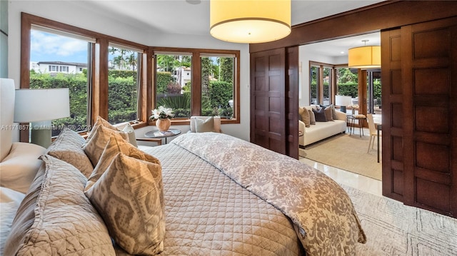 tiled bedroom with multiple windows