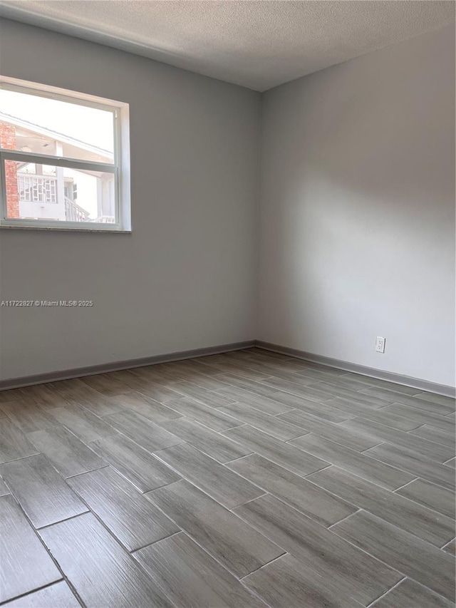 spare room featuring a textured ceiling