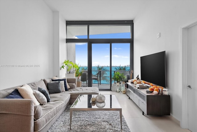 living room featuring floor to ceiling windows