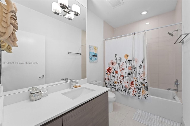 full bathroom with tile patterned floors, shower / bath combo, toilet, and vanity