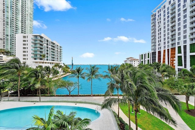 view of swimming pool featuring a water view