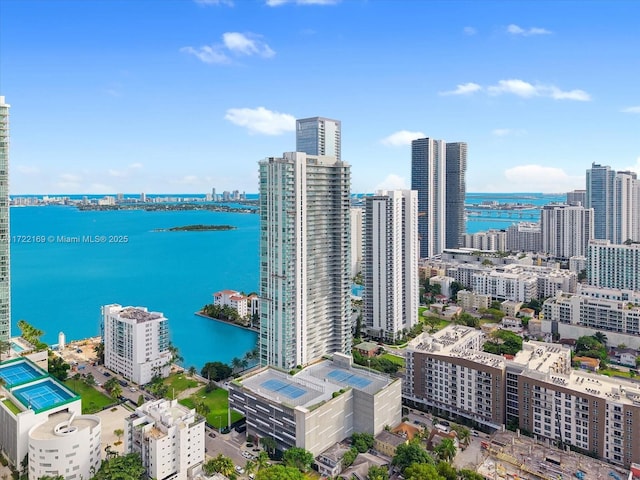 birds eye view of property with a water view