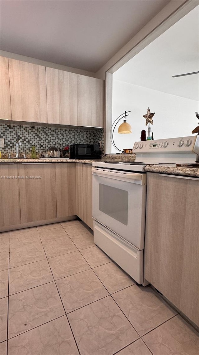 kitchen featuring electric range, light brown cabinets, sink, decorative backsplash, and light tile patterned floors