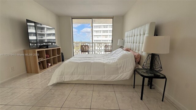 bedroom featuring floor to ceiling windows