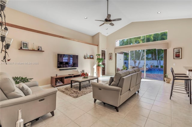 living room featuring ceiling fan, light tile patterned floors, and high vaulted ceiling