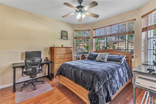 bedroom with hardwood / wood-style flooring and ceiling fan