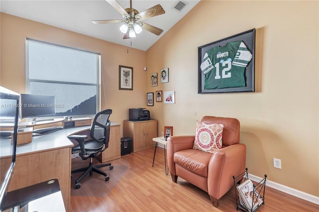 office area with ceiling fan, light wood-type flooring, and vaulted ceiling