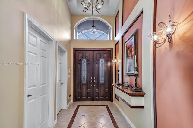 entryway featuring a chandelier