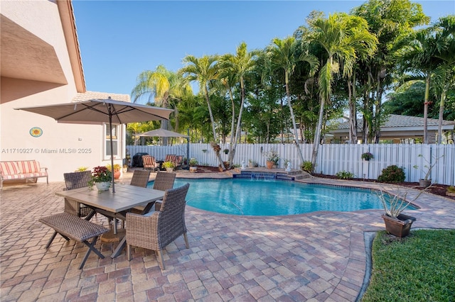 view of swimming pool featuring a patio area and pool water feature