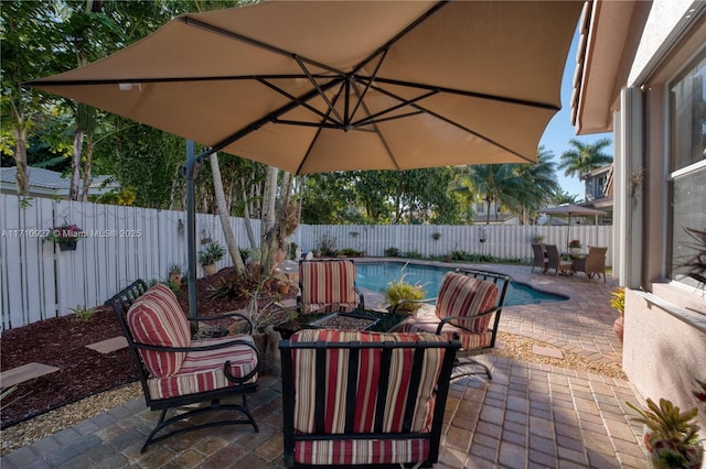 view of patio featuring a fenced in pool