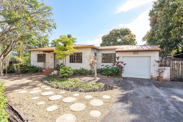 single story home with a garage