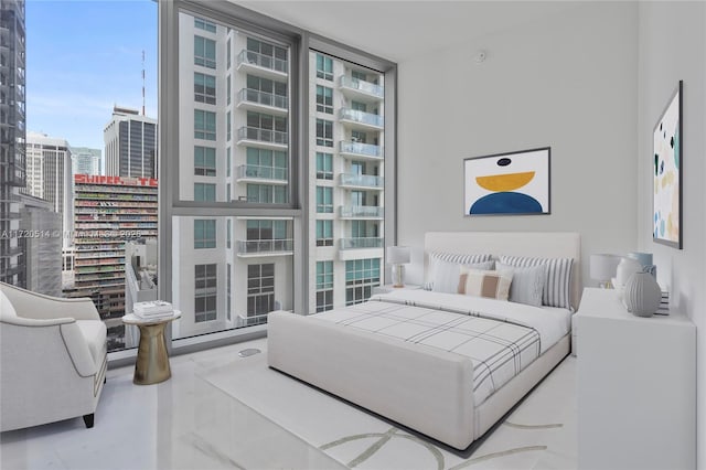 bedroom featuring floor to ceiling windows