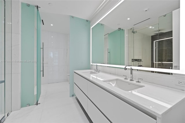 bathroom featuring tile patterned flooring, vanity, an enclosed shower, and toilet