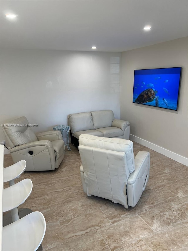 living room with baseboards and recessed lighting