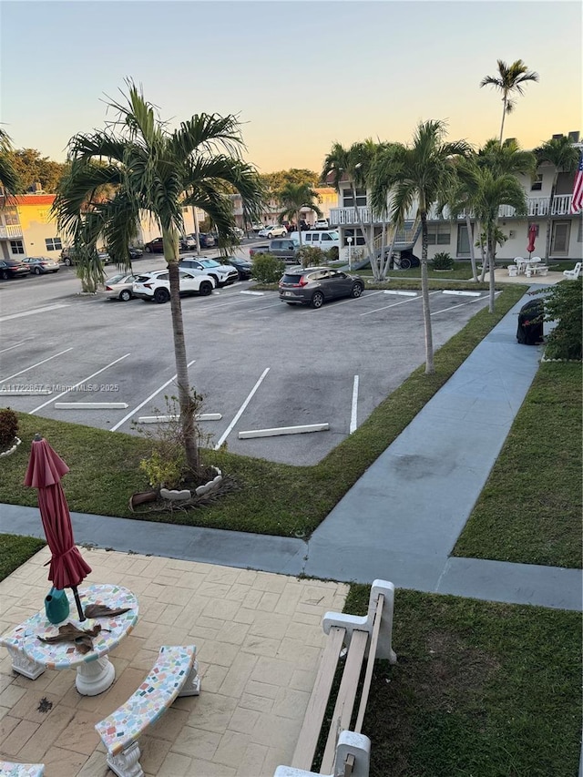 view of parking at dusk