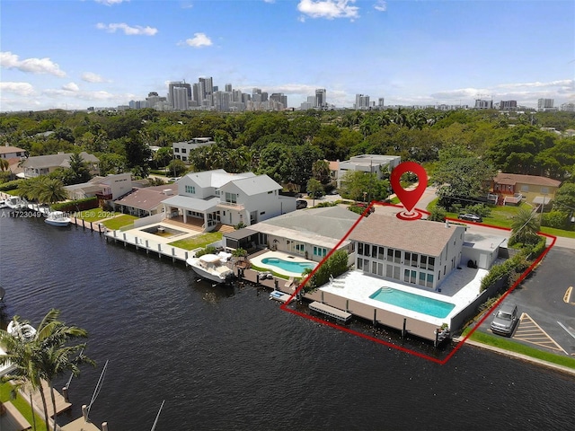 birds eye view of property with a water view