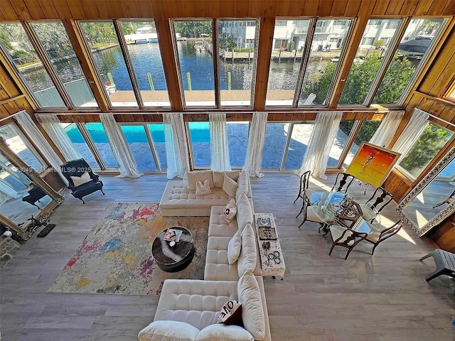 unfurnished sunroom featuring a water view