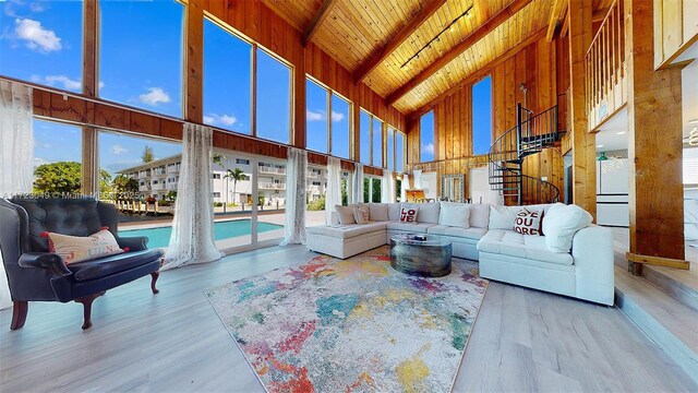 sunroom / solarium with vaulted ceiling with beams and wood ceiling