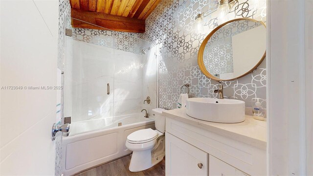 full bathroom with wooden ceiling, beamed ceiling, wood-type flooring, toilet, and bathtub / shower combination