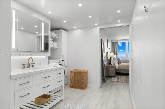 bathroom featuring vanity and wood-type flooring