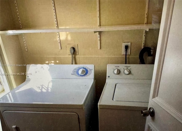 laundry room with separate washer and dryer