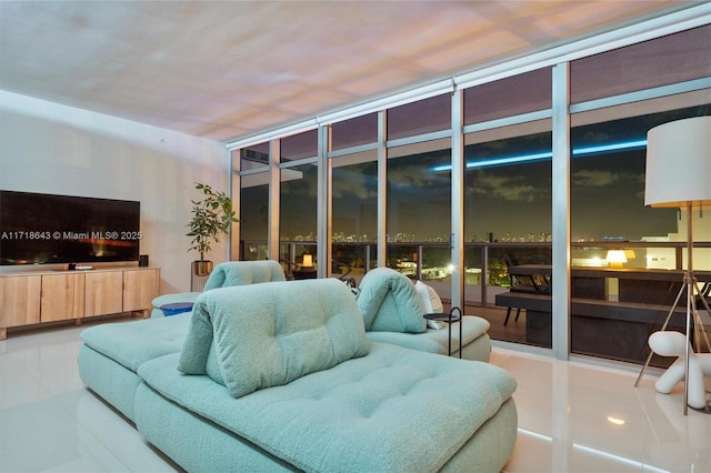 living room featuring tile patterned flooring and expansive windows