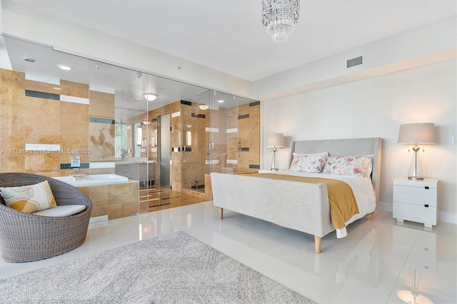 tiled bedroom featuring a chandelier