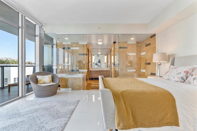 bedroom featuring a wall of windows and access to outside