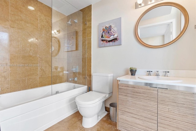 full bathroom featuring tile patterned flooring, tiled shower / bath combo, toilet, and vanity