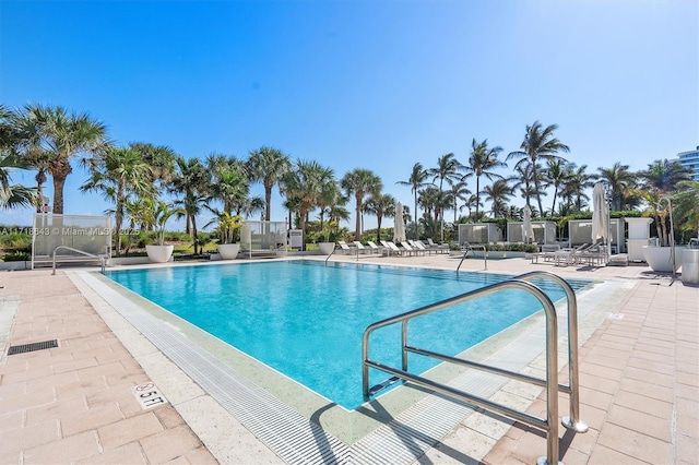 view of swimming pool with a patio