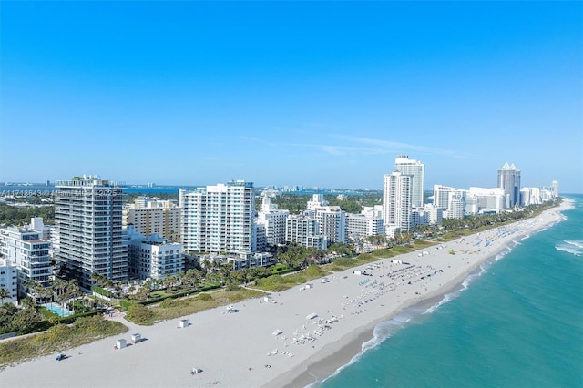 bird's eye view with a beach view and a water view