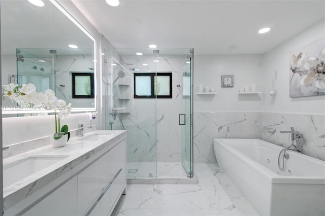 bathroom with separate shower and tub, vanity, and tile walls