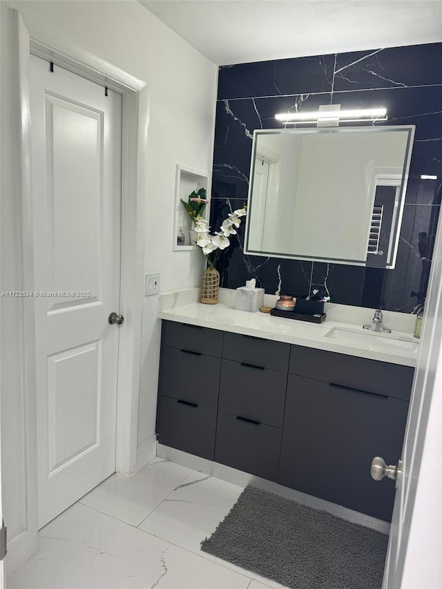 bathroom featuring decorative backsplash and vanity