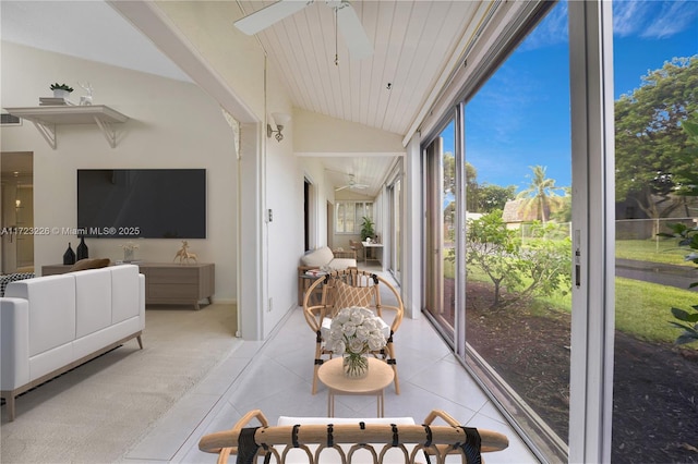 sunroom with ceiling fan, wooden ceiling, and vaulted ceiling