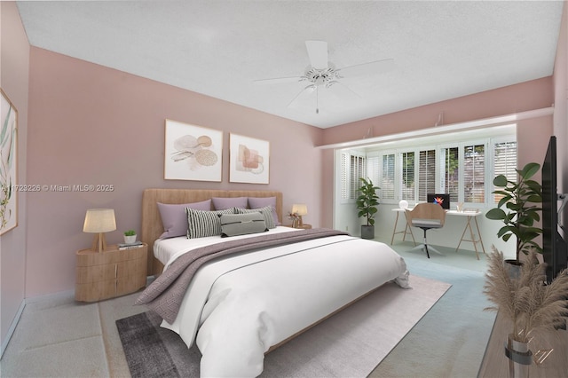 bedroom with a textured ceiling, carpet floors, and ceiling fan