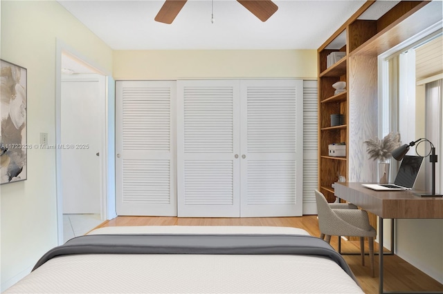 bedroom with light wood-type flooring and ceiling fan