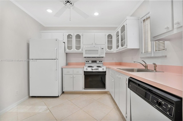 kitchen featuring white appliances, ceiling fan, sink, light tile patterned floors, and white cabinets