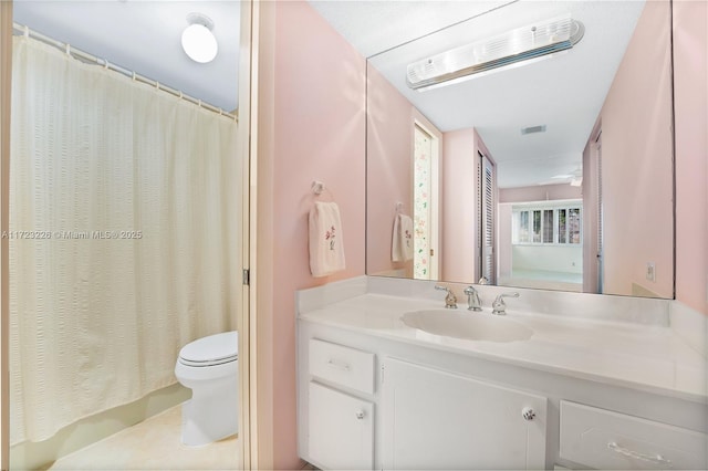 bathroom with vanity and toilet