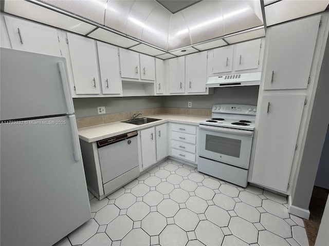 kitchen featuring white cabinetry, white appliances, and sink